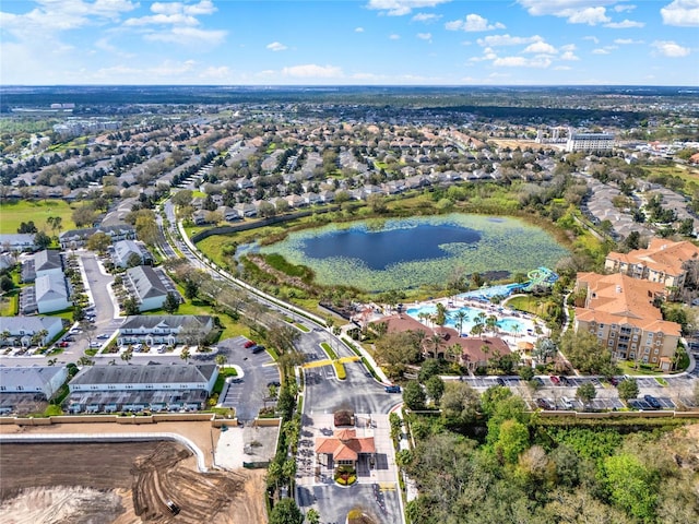 bird's eye view featuring a water view and a residential view