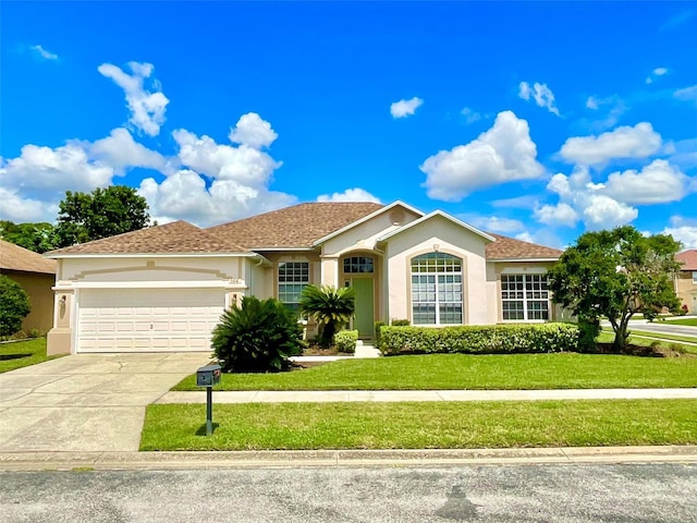 ranch-style house featuring a garage, a front lawn, concrete driveway, and stucco siding