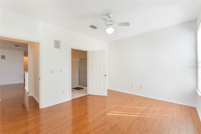 spare room featuring hardwood / wood-style flooring and ceiling fan