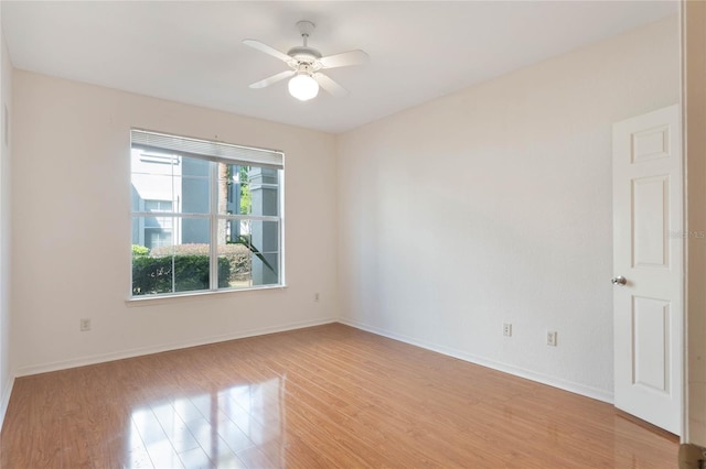 unfurnished room featuring ceiling fan and light wood-type flooring