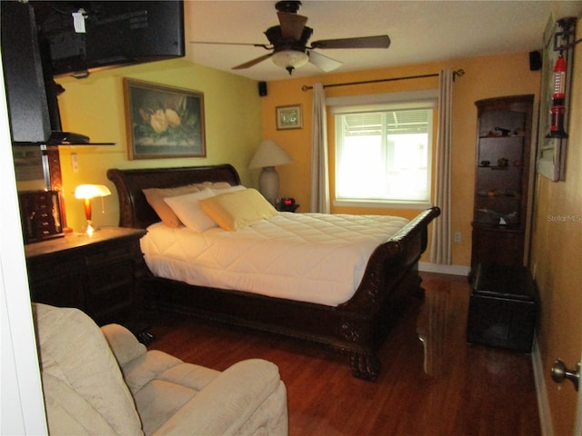 bedroom featuring dark hardwood / wood-style floors and ceiling fan