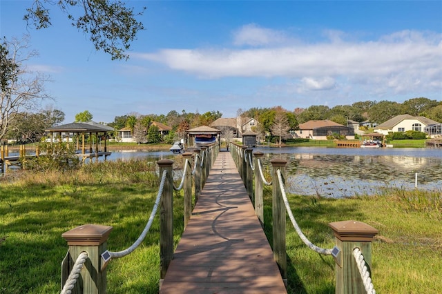 view of dock with a water view and a gazebo