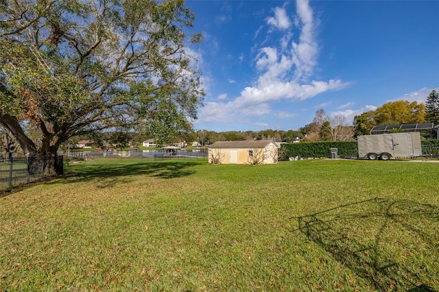 view of yard featuring a storage unit