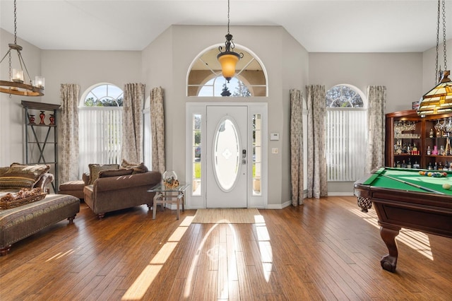 foyer entrance with pool table and hardwood / wood-style floors