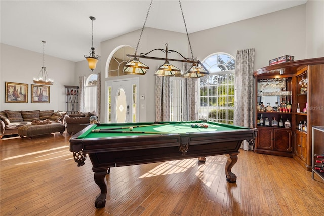 recreation room featuring high vaulted ceiling, pool table, and light hardwood / wood-style flooring