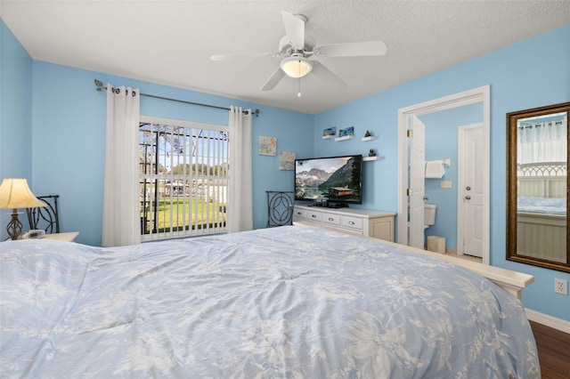 bedroom with hardwood / wood-style floors, ceiling fan, and a textured ceiling