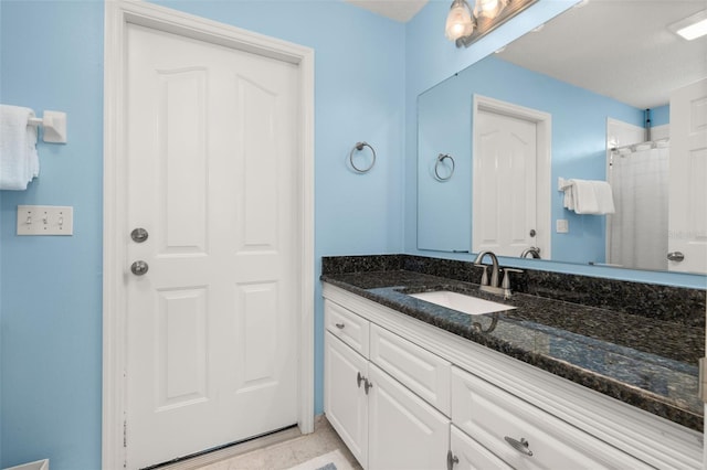 bathroom featuring vanity and walk in shower