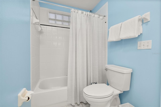 bathroom featuring toilet and shower / bath combo with shower curtain