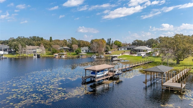 view of dock featuring a yard and a water view