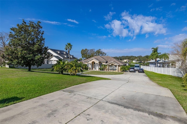 ranch-style home featuring a front yard