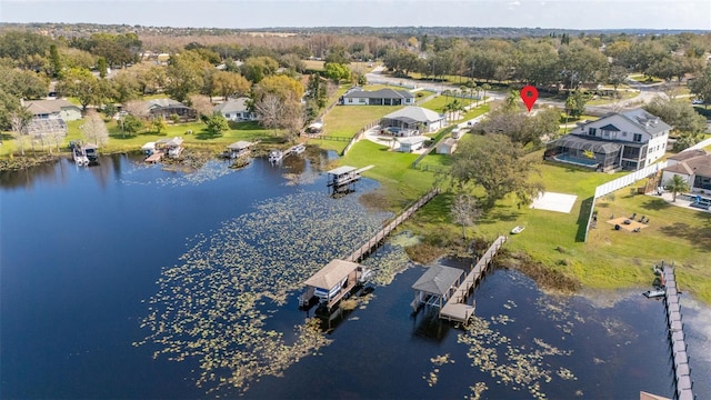 birds eye view of property with a water view