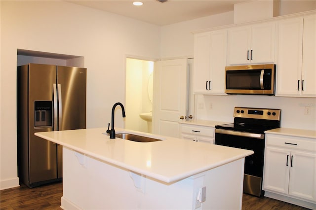 452 Diamond Dove Cv, Winter Springs, FL 32708 - kitchen featuring stainless steel appliances, white cabinetry, sink, and a center island with sink