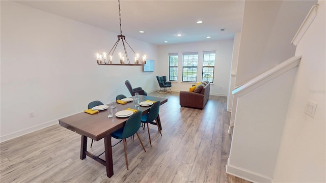 452 Diamond Dove Cv, Winter Springs, FL 32708 - dining room featuring an inviting chandelier and light wood-type flooring