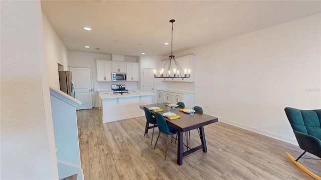 452 Diamond Dove Cv, Winter Springs, FL 32708 - dining space featuring a chandelier and light hardwood / wood-style flooring