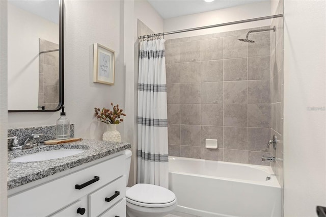 full bathroom with vanity, shower / tub combo with curtain, and toilet