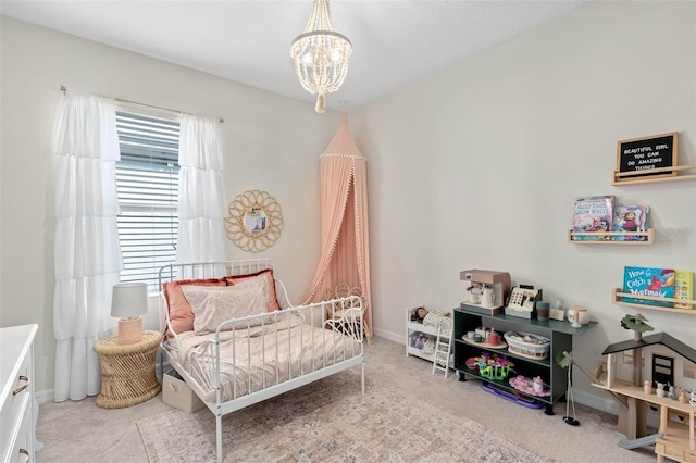 bedroom featuring baseboards, light carpet, and a notable chandelier