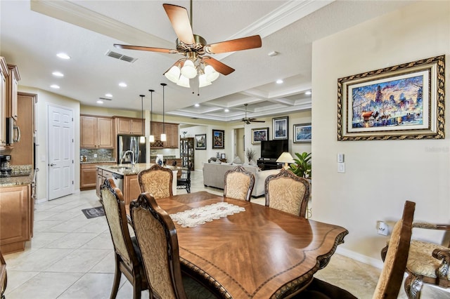 dining room with coffered ceiling, light tile patterned floors, sink, ceiling fan, and beam ceiling