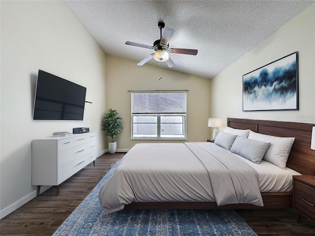 bedroom with ceiling fan, a textured ceiling, dark wood-style flooring, baseboards, and vaulted ceiling