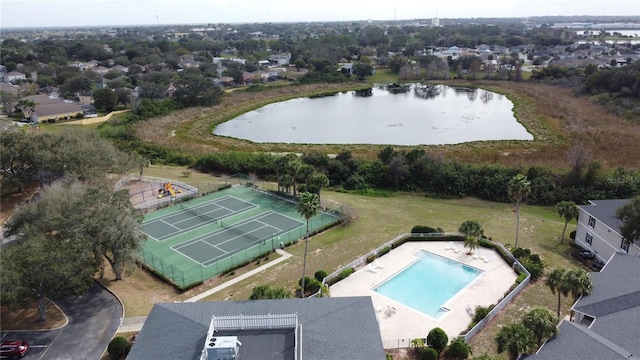 birds eye view of property with a water view