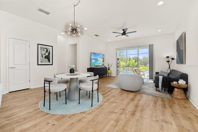 dining space featuring light wood-type flooring, an inviting chandelier, visible vents, and recessed lighting