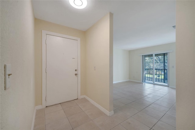 foyer featuring light tile patterned flooring