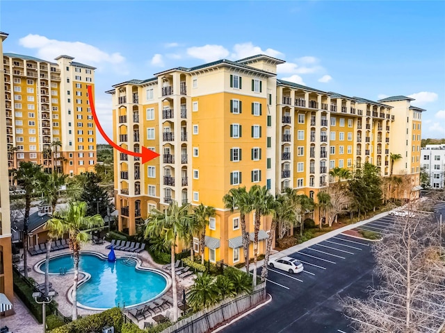 view of property featuring a community pool