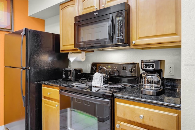 8100 Poinciana Blvd Unit 2501, Orlando, FL 32821 - kitchen featuring black appliances, dark stone countertops, and tile patterned floors