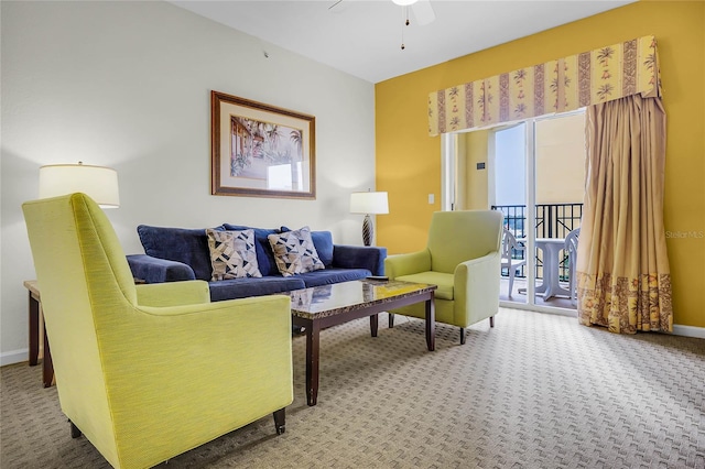 8100 Poinciana Blvd Unit 2501, Orlando, FL 32821 - carpeted living area with ceiling fan and baseboards