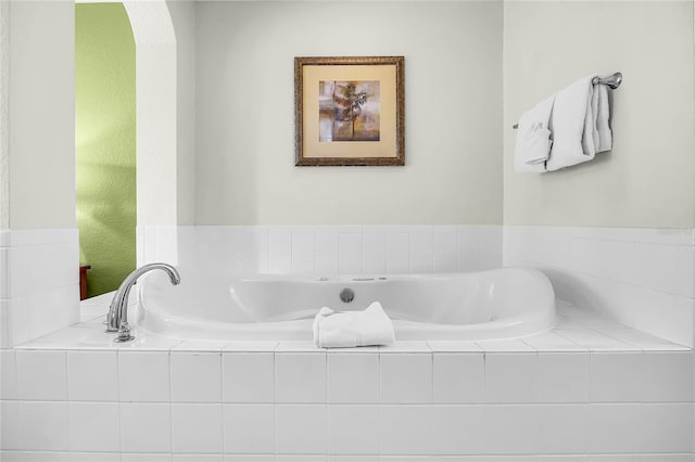 8100 Poinciana Blvd Unit 2501, Orlando, FL 32821 - full bathroom with a relaxing tiled tub
