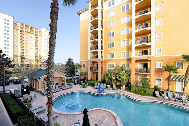 8100 Poinciana Blvd Unit 2501, Orlando, FL 32821 - community pool with a patio and fence