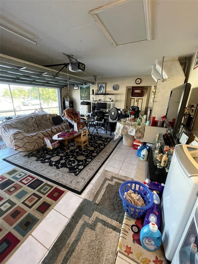 interior space featuring washer / dryer and tile patterned flooring