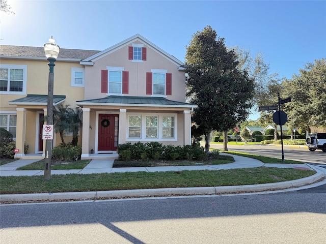 view of front property featuring a front yard