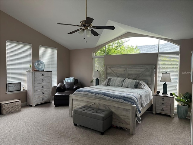 bedroom featuring vaulted ceiling, carpet flooring, and ceiling fan