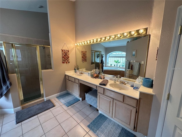 bathroom with plus walk in shower, tile patterned flooring, and vanity