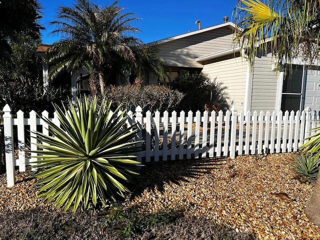 view of side of home with fence