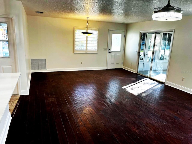 9319 SE 173rd Hyacinth St, The Villages, FL 32162 - interior space featuring dark wood-style floors, baseboards, and visible vents