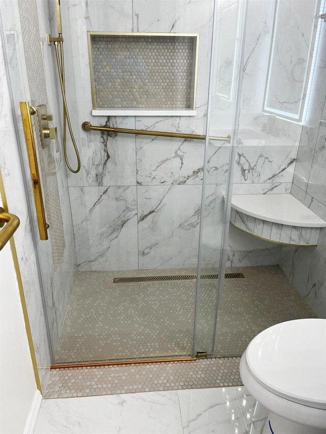 9319 SE 173rd Hyacinth St, The Villages, FL 32162 - full bath with marble finish floor, a marble finish shower, and toilet