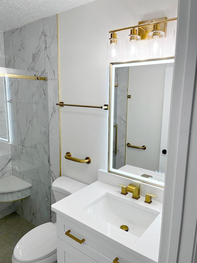 9319 SE 173rd Hyacinth St, The Villages, FL 32162 - full bath featuring a marble finish shower, toilet, vanity, and a textured ceiling