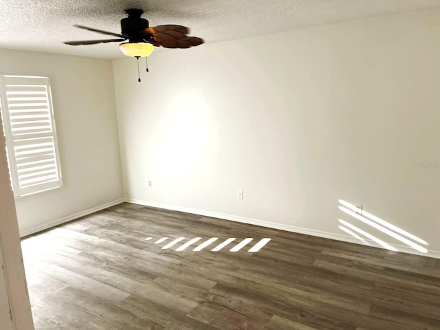 9319 SE 173rd Hyacinth St, The Villages, FL 32162 - empty room featuring ceiling fan, a textured ceiling, baseboards, and wood finished floors