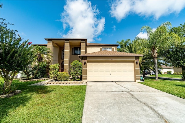 view of front of property featuring a front yard and a garage