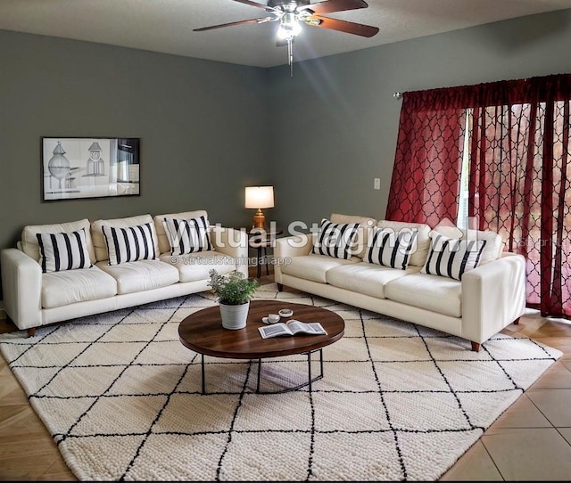 living area with ceiling fan