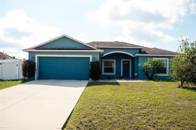 single story home with a front lawn and a garage