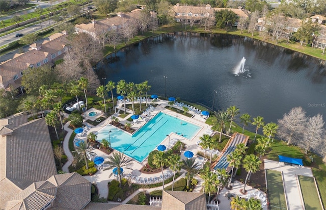 drone / aerial view with a water view and a residential view