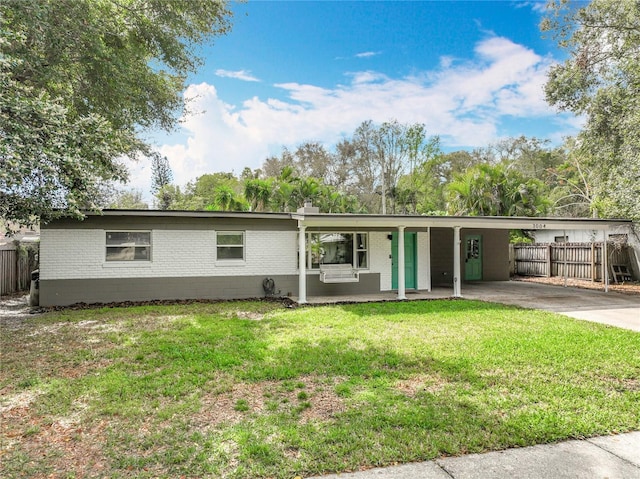 3004 Lake Margaret Dr, Orlando, FL 32806 - ranch-style home featuring brick siding, an attached carport, concrete driveway, and covered porch