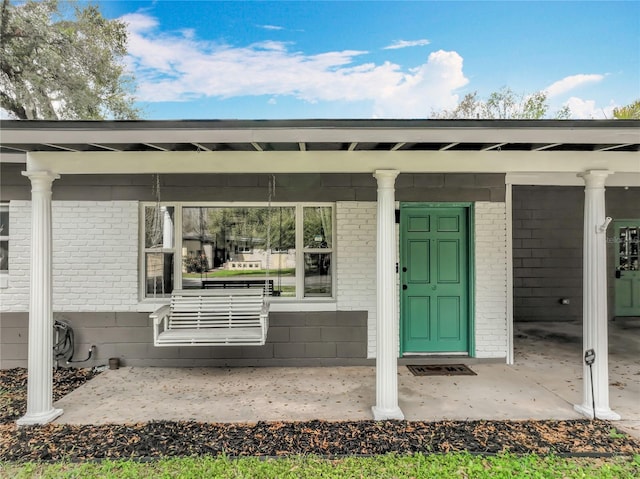 3004 Lake Margaret Dr, Orlando, FL 32806 - entrance to property with brick siding and a porch