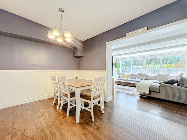 3004 Lake Margaret Dr, Orlando, FL 32806 - dining area featuring a chandelier and wood finished floors