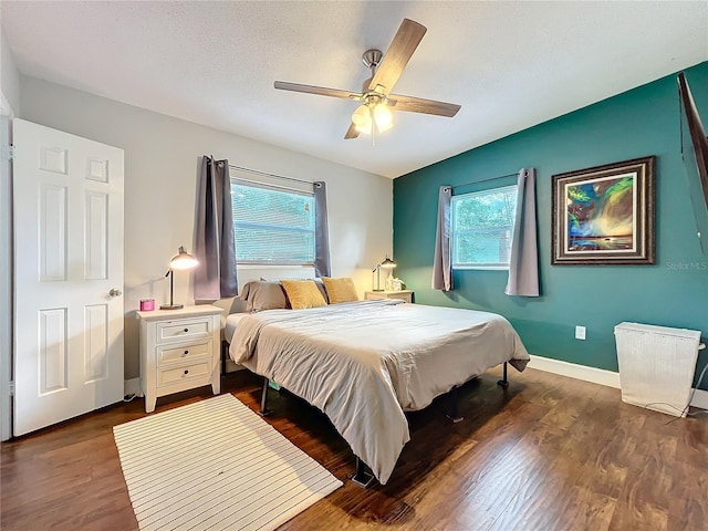 3004 Lake Margaret Dr, Orlando, FL 32806 - bedroom featuring multiple windows, dark wood finished floors, and ceiling fan