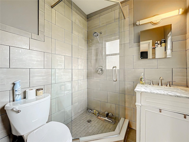 3004 Lake Margaret Dr, Orlando, FL 32806 - bathroom with tile walls, a shower stall, and vanity