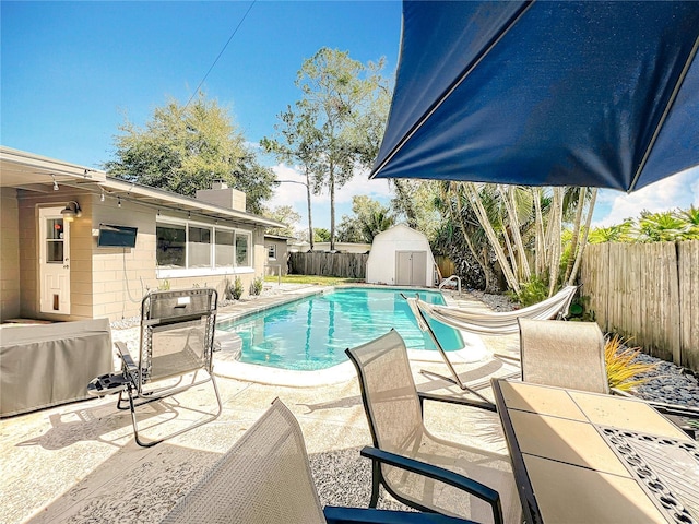 3004 Lake Margaret Dr, Orlando, FL 32806 - view of pool featuring a patio, a fenced backyard, and a storage shed