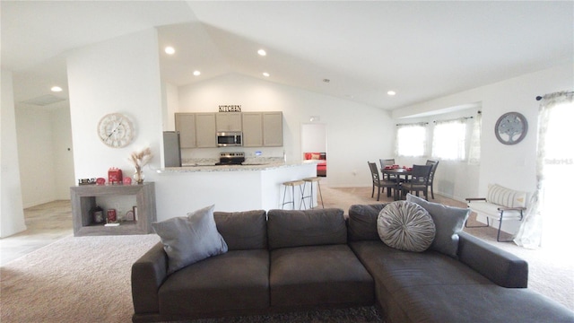 living room featuring high vaulted ceiling and light carpet